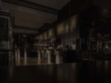 The same photo of the room, dark and out of focus